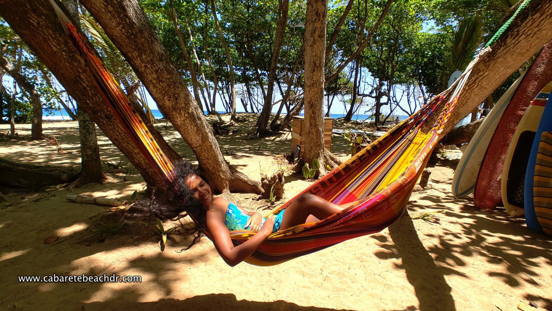 Young girl relaxing in hammock