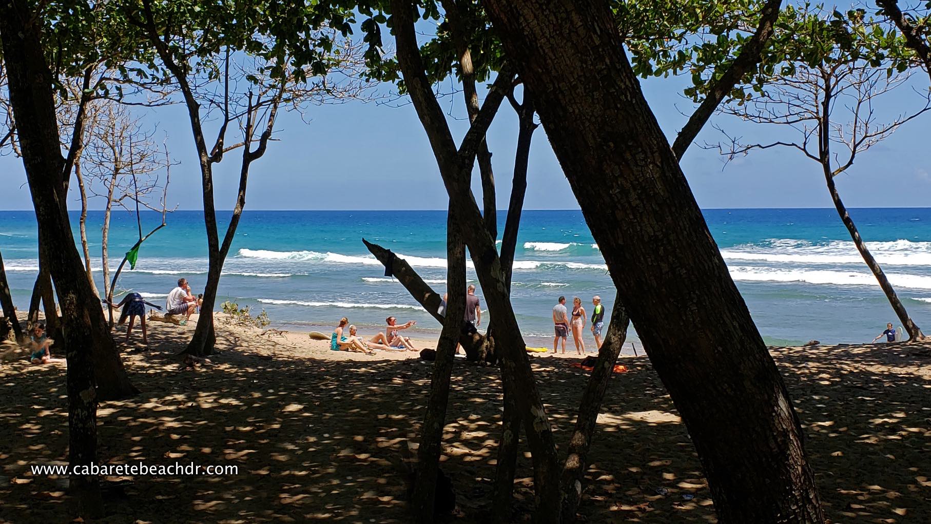 People watch the waves break in Encuentro