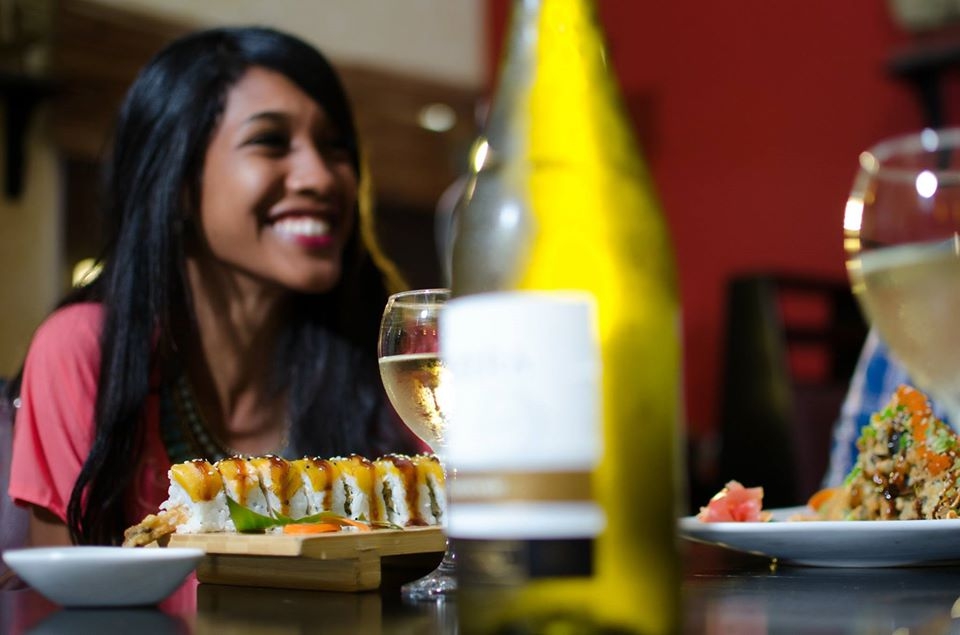 Girl smiles at table